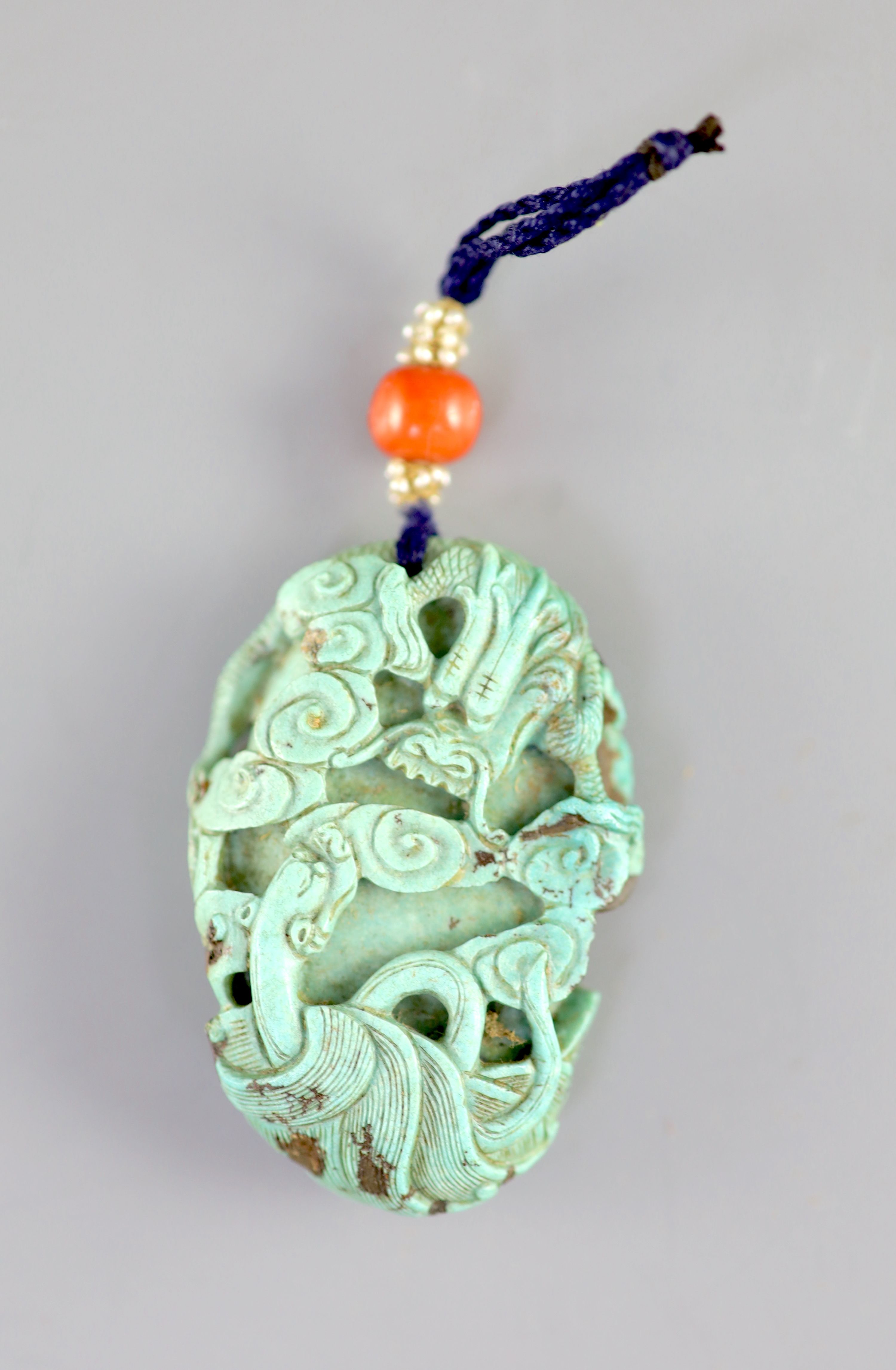 A Chinese turquoise matrix ‘dragon’ pendant, 19th century 5.4cm long